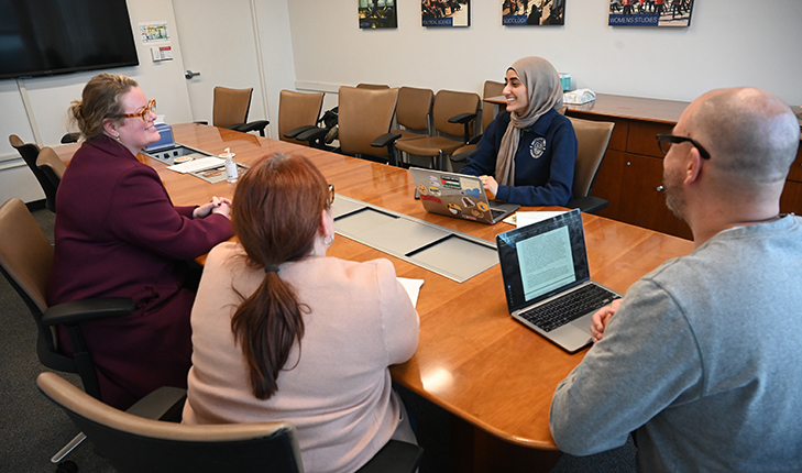Newly elected student body president Camalah Saleh meets with faculty in the Department of Political Science. (Photo by Geoff Thurner)