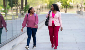 Jadora and Jazzmine White walking by Fresno State library