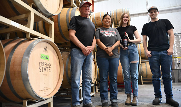 Fresno State winemaker Tom Montgomery (left) with students Malia Mora, Preston Jenkins and Keara McVicker.