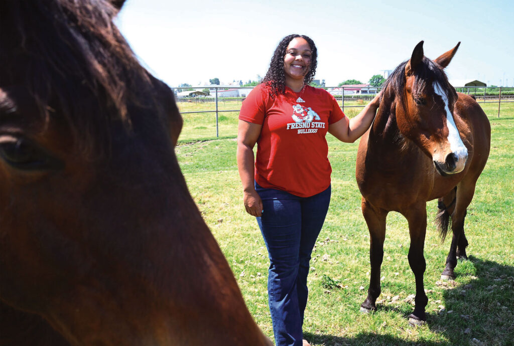 Amelia DiPaola Robinson with horses