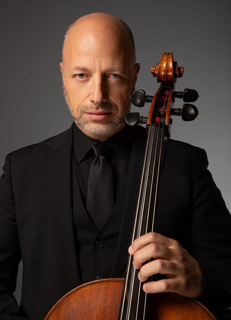 Dr. Thomas Loewenheim holds a cello