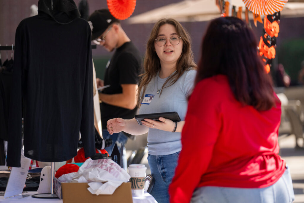 Students from ENTR 155E work at the Craig School of Business Pop Up Store