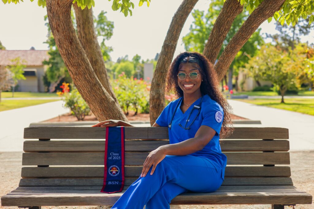 Student in blue nursing scrubs