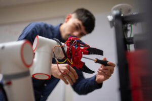 Juan Espinoza working in mechanical engineering lab