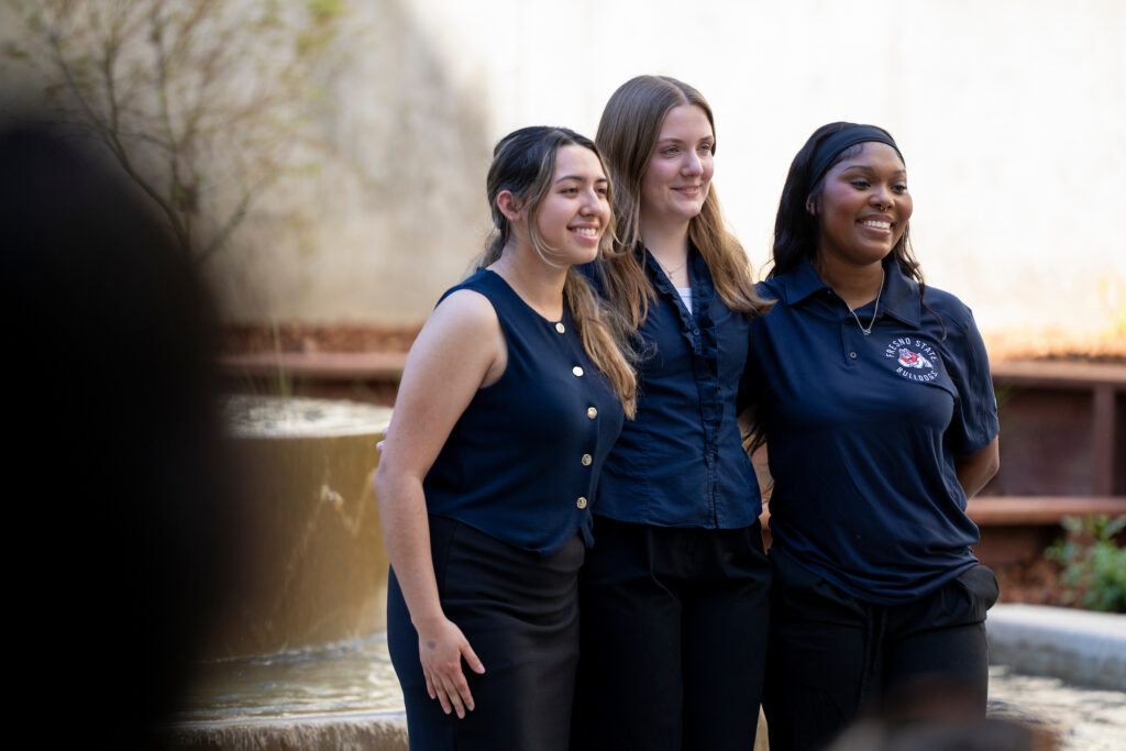 Students Kirsten Martinez, Faith Bither and Kennedi Campbell-Caldwell at Peters Building fountain ribbon cutting ceremony