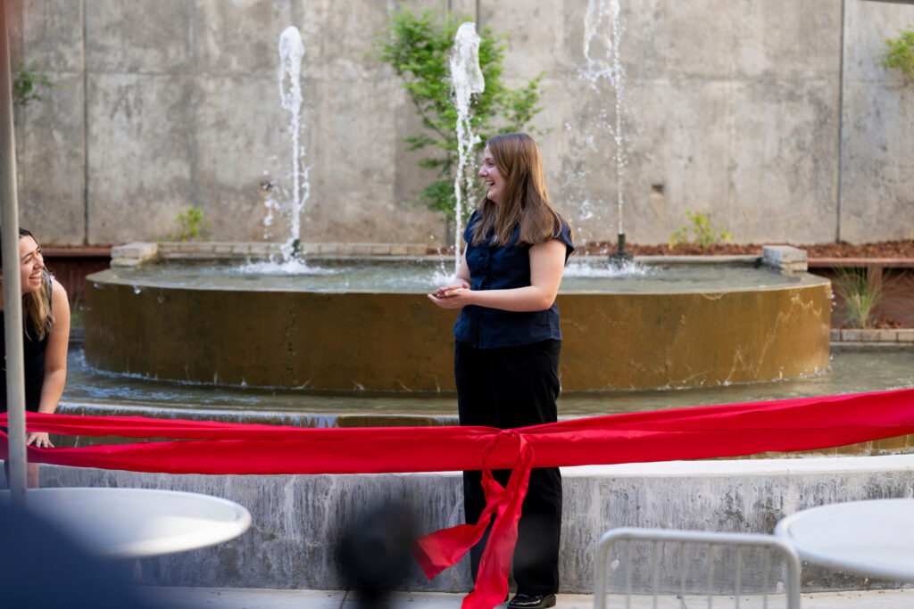 Faith Bither about the cut the ribbon on the restored Peters Building Fountain