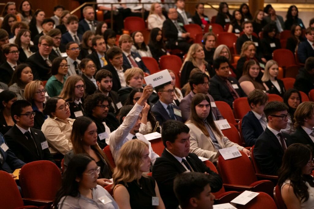 Students seated in audience participating in the Model UN event