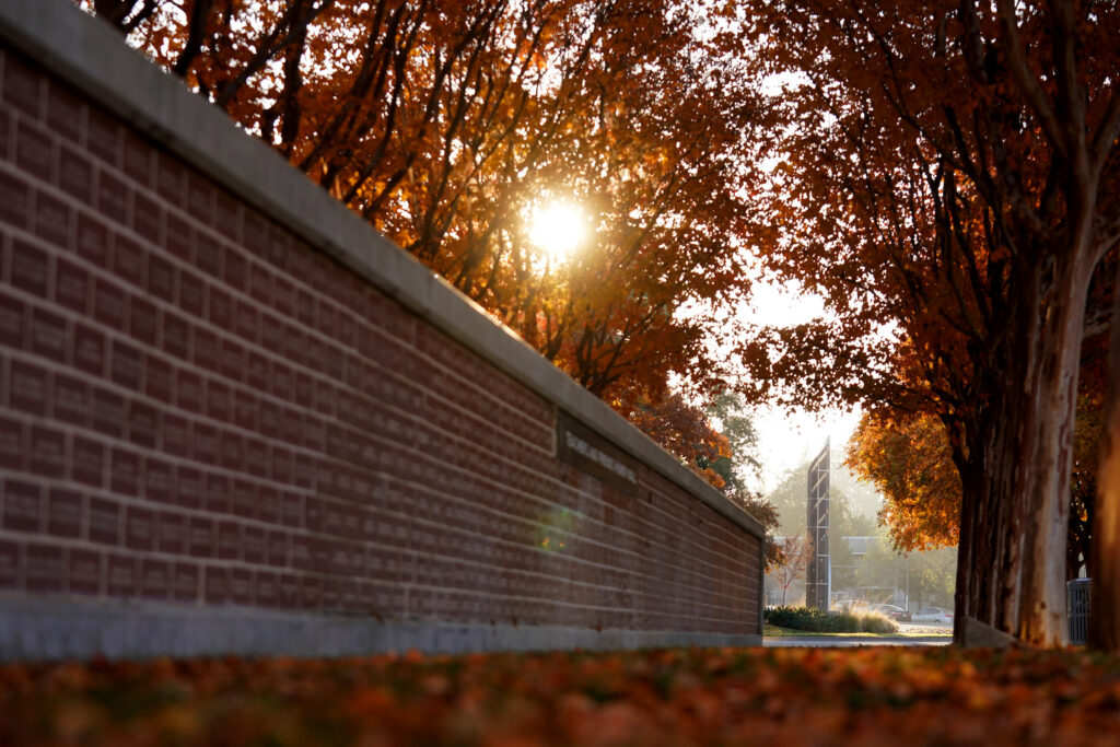 The Teachers and Friends of Education Honor Wall is seen at sunrise on a Fall morning.