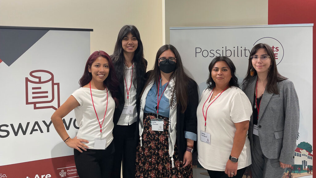 Left to Right: Stephanie Aquino-Alcala, Giselle Ossun, Dr. Rosa Chavez, Maria Turnbull and Lauren Stanger in front of SWAYWO banners.