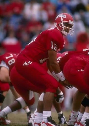 Jim Arellanes takes the snap.