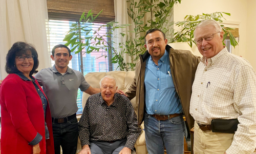 Rodger Jensen and his son, Doug, visit with Fresno state agricultural alumni Armando and Rigoberto Guzman who had previously received student scholarships through the Jensen Scholars program on campus.