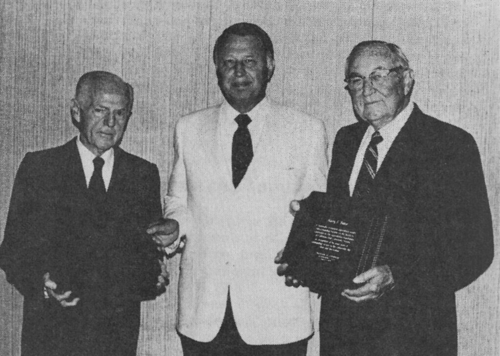 Russell Giffen (left) and Harry Baker (right) received plaques from Rodger Jensen (center), Chairman of the California State University, Fresno Agricultural Foundation Board of Governors, naming them emeritus governors of the Board for their years of service to the Foundation and the University. Photo taken from 'A History of the Growth and Development of Agriculture at California State University Fresno, 1911-1984 by Lloyd Dowler, page 168, Desc: 00005864