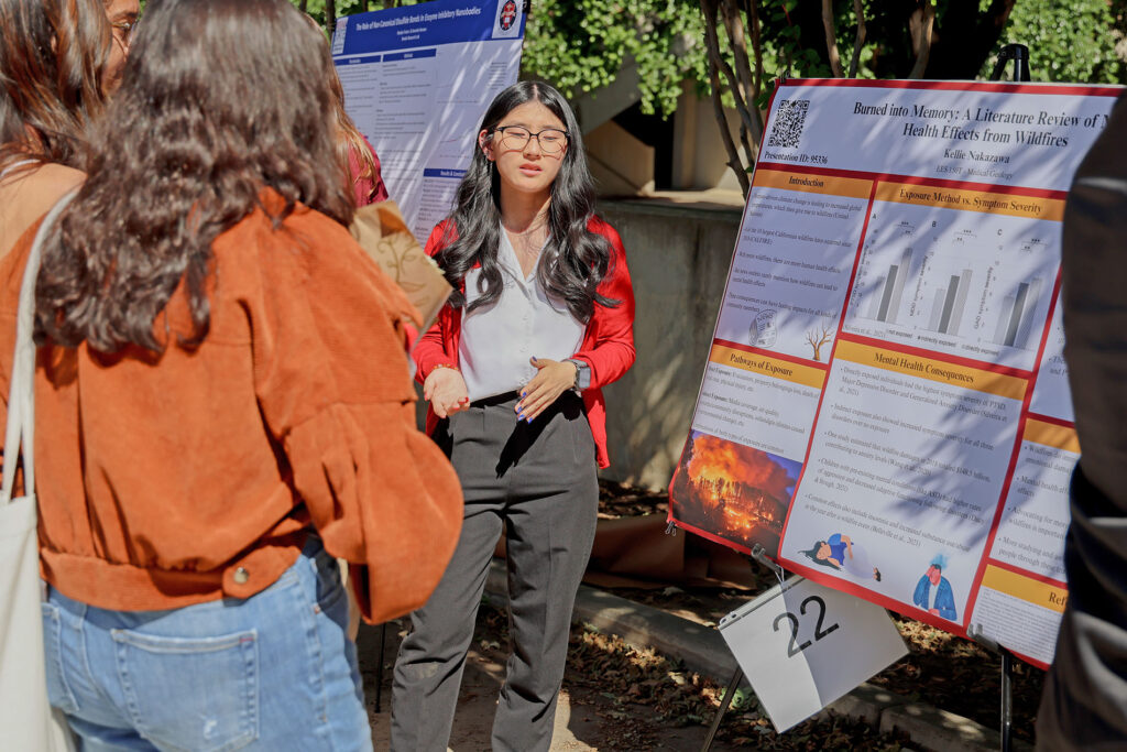 Student Kellie Nakazawa presents her project "Burned Into Memory: A Literature Review of Health Effects from Wildfires" at the spring 2026 Showcase of Excellence, presented by the College of Science and Mathematics at Fresno State.