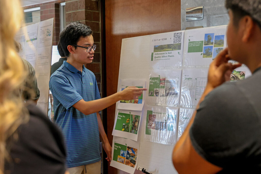 Student presents his project "Differences in Soil Quality Affect Plants" at the spring 2026 Showcase of Excellence, presented by the College of Science and Mathematics at Fresno State.