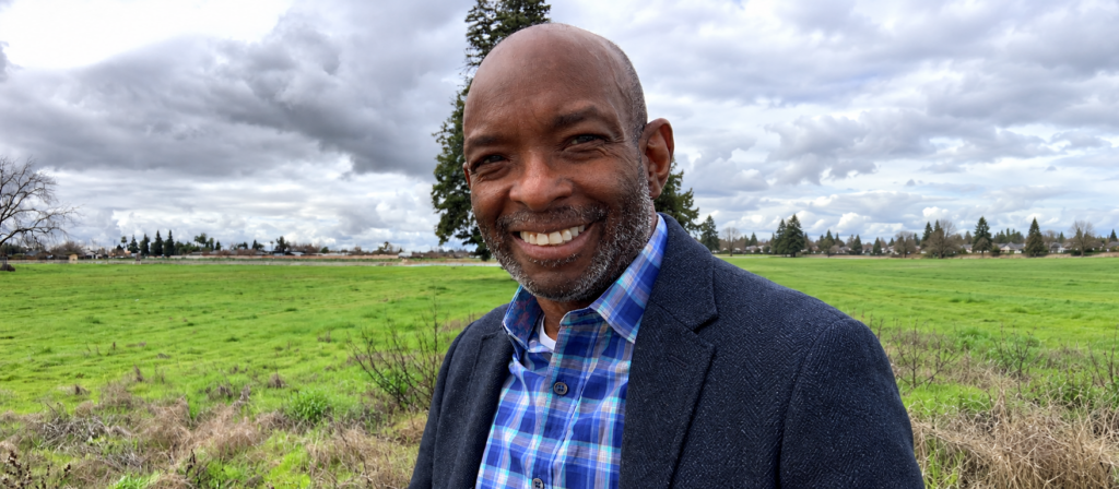 Kerry McBee standing in a green field